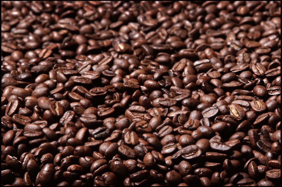 AMGHAN Background of delicious freshly roasted coffee beans selective focus. Image shot 2007. Exact date unknown.